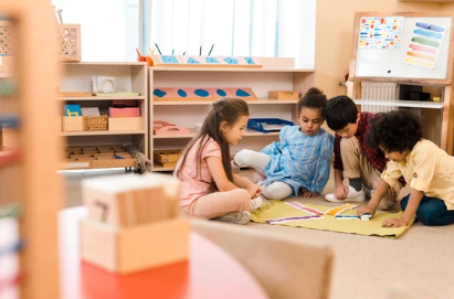 Nursery children working in Montessori classroom